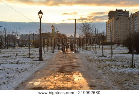 Alley at winter evening in microdistrict Rybatskoe on the outskirts of St. Petersburg, Russia.