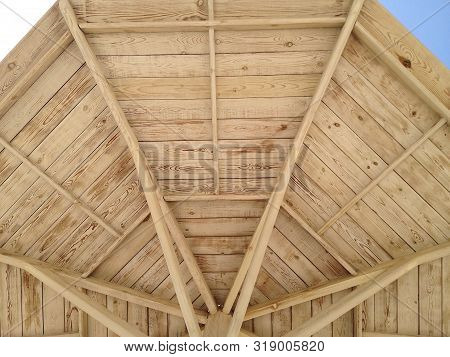 Close-up Of A Part Of A Wooden Beach Umbrella