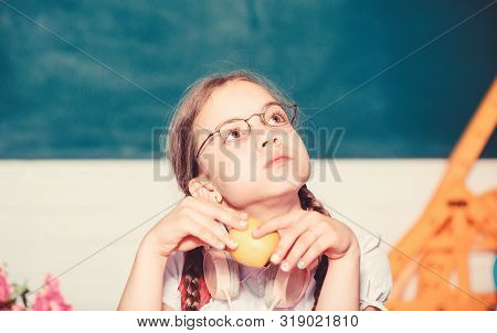 Small Girl Ready To Eat Apple. Smart Child Concept. Healthy Eating Is Good. Small Genius Child In Cl