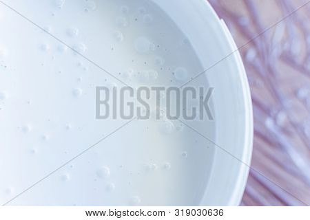 Can Of White Paint On The Floor , The Floor Is Covered With A Oilcloth For Protection