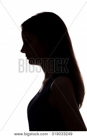 Young Woman Look Down With Flowing Hair - Vertical Silhouette