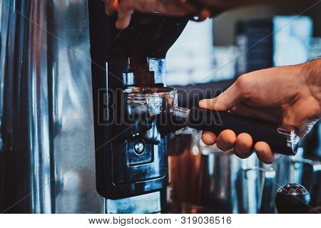 Diligent Barista Is Prepairing Fresh Latte For Customers For Coffee Break At Caffeteria.