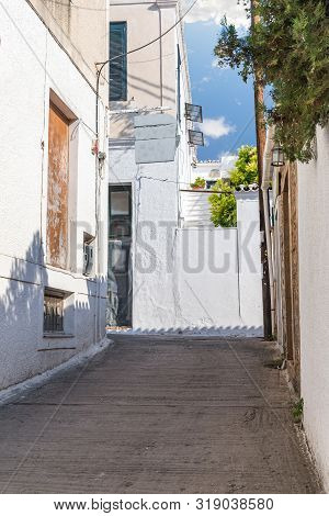 Walking On Traditioanal Greek Streets With White House, Spetses Saronic Gulf, Greece
