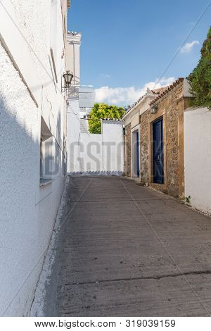 Walking On Traditioanal Greek Streets With White House, Spetses Saronic Gulf, Greece