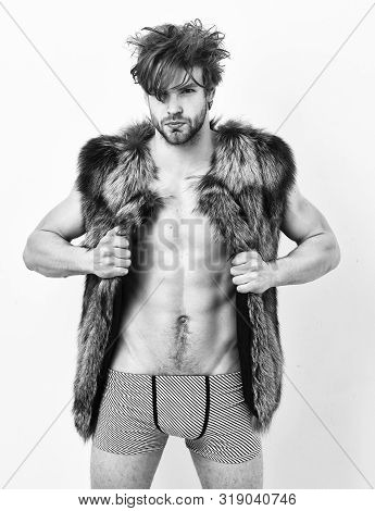 Richness And Luxury Lifestyle. Sexy Sleepy Rich Macho Tousled Hair Fur Vest On White Background. Guy