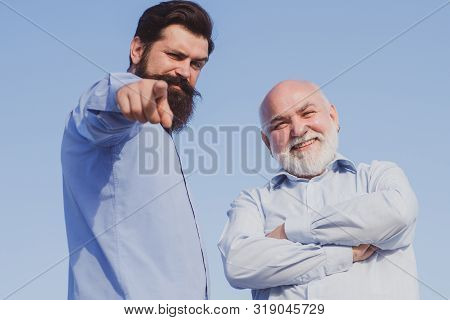 Elderly Pensioner And Hipster Son. Elderly Senior Man And Bearded Son - Two Generation Concept. Two 