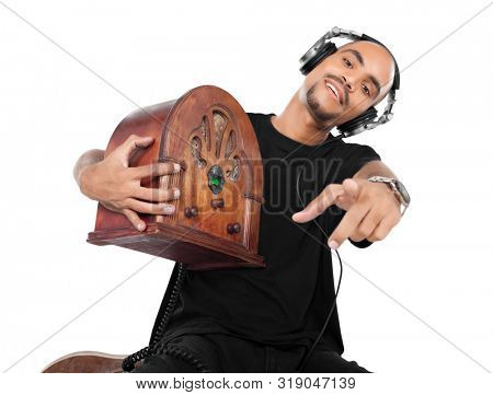 African musician singer with headphones holding a vintage radio
