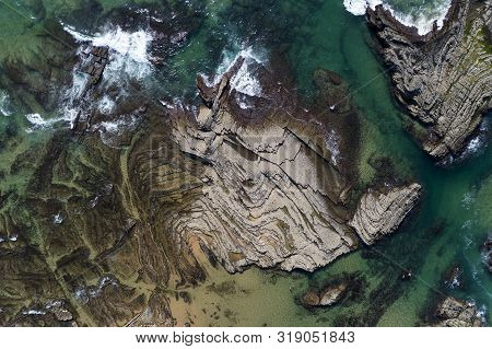 Aerial View Of The Rock Formations At The Carreagem Beach In Aljezur, Algarve;