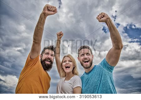 Yes We Can. Woman And Men Look Confident Successful Sky Background. Behaviors Of Cohesive Team. Cele