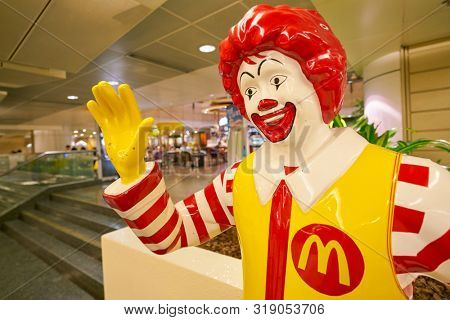 SINGAPORE - CIRCA APRIL, 2019: Ronald McDonald statue in greeting guests at Changi International Airport. 