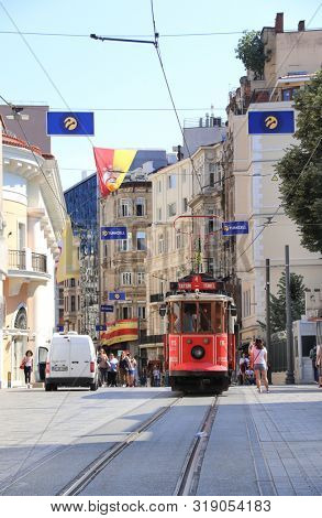 ISTANBUL, TURKEY - JUNE 7, 2019: Retro red tram Taksim-Tunel on famous Istiklal street