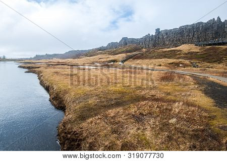 Scenery View Of The High Rock Wall Of Logberg (law Rock) Of Thingvellir National Park The Unesco Wor