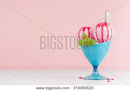 Tasty Fresh Pink Ice Cream In Blue Bowl With Strawberry Sauce, Silver Spoon, Green Mint On White Woo