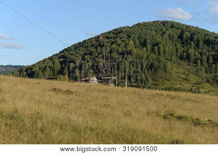 Tv Tower Near The Taiga Village Of Generalka In The Mountains Of Altai Krai