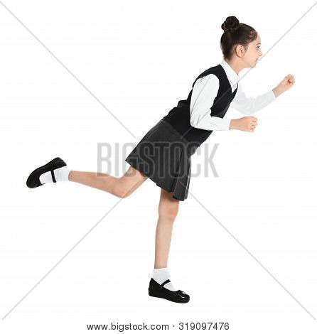 Happy Girl In School Uniform Walking On White Background