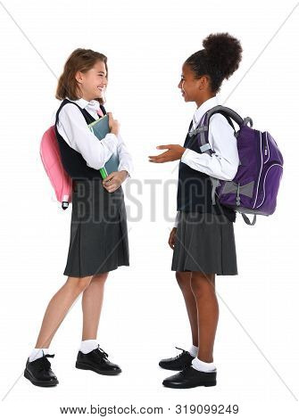Happy Girls In School Uniform On White Background