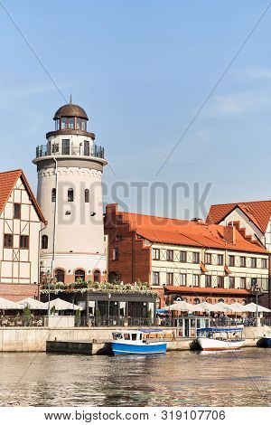 Kaliningrad, Russia - August 24, 2019: View Of The Fish Village And Lighthouse On The Embankment Of 