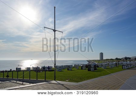 Typical Beach Chairs On The Lawn At The North Sea Coast In Büsum, The Famous Tourism Resort In Schle