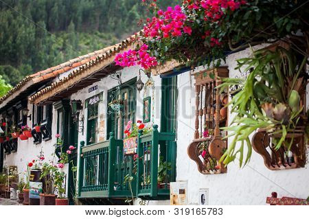 Duitama, Colombia - August, 2019: Beautiful Facades Of The Houses At The Touristic Place Called Pueb