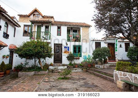 Duitama, Colombia - August, 2019: Beautiful Facades Of The Houses At The Touristic Place Called Pueb