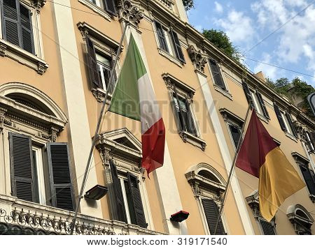 Italian Flag On Building Across Sky And Architecture