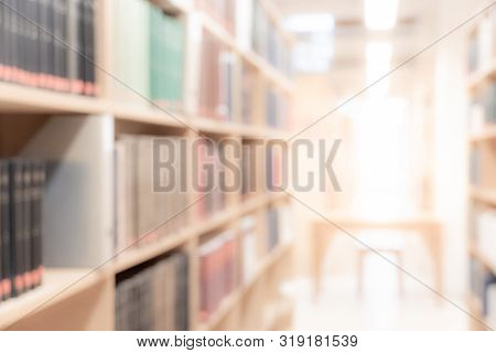 Abstract Blurred Public Library Interior Space. Blurry Room With Bookshelves By Defocused Effect. Us