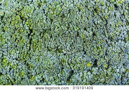 Natural Food Background - Fresh Broccoli Flowers On Cabbagehead Close-up
