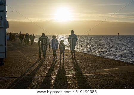 Hunstanton, Norfolk, England, Uk - January 1, 2019: People Walking In Foggy Winter Day In Hunstanton