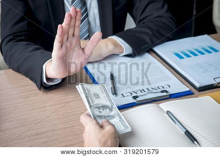 Anti Bribery And Corruption Concept, Business Man Refusing And Don't Receive Money Banknote Offer Fr