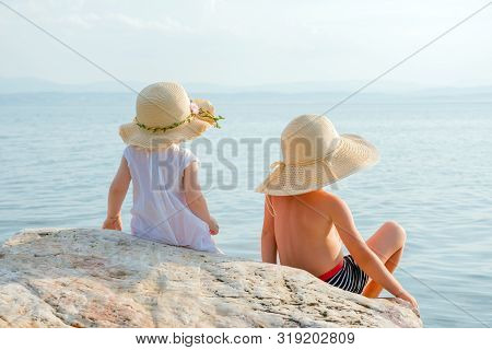 Children Near The Water. Happiness Background. Wedding Day. Beautiful Children Looking To Ocean. Hap
