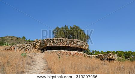 Loophole Embrasure Old Military Bunker, Artillery Fire Control Center On Blue Sky Background. An Aba
