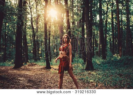 Enjoying Her Beauty. Ethnic Tribal Fashion. Deep Forest. Sexy Girl In Leather Suede Clothes. Cougar 