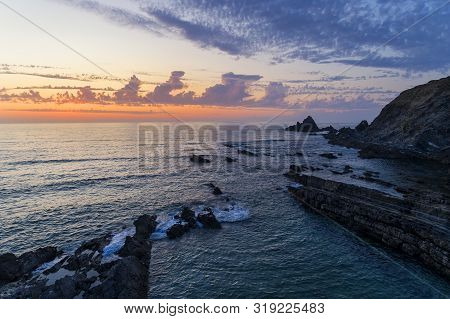 View Of The Beautiful Alteirinhos Beach At Zambujeira Do Mar, Alentejo, At Sunset.