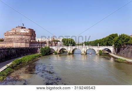 Ponte Santangelo And Castel Santangelo - Rome, Italy. Tourist Boat Passes Under Ponte Santangelo.