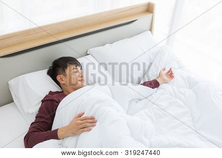 Close Up Shot Of Asian Handsome Man Lying On Comfort Bed, He Slept Deep In Bedroom.