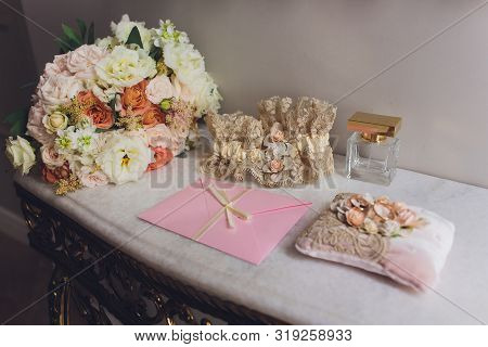 Tender Brides Bouquet In Yellow And White Colors And Wedding Rings On A Pillow.