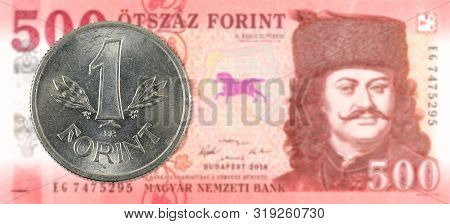 1 Hungarian Forint Coin Against A New 500 Hungarian Forint Banknote Indicating Growing Economics Wit