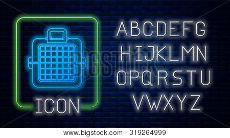 Glowing Neon Pet Carry Case Icon Isolated On Brick Wall Background. Carrier For Animals, Dog And Cat