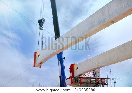 Tower Crane With Guideway Beam On Blue Sky As A Background In The Construction Site, Space For Text 