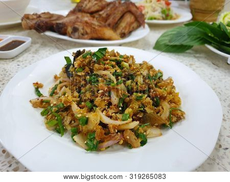 Thai Food Style, Spicy Minced Fish Salad Or Catfish In Spicy Condiment With Herbs On White Plate In 