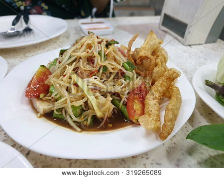 Thai Food Style, Selective Focus Of Papaya Salad And Pork Crackling In Restaurant, This Food Is Most