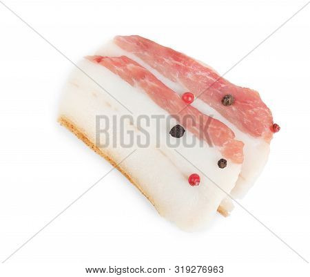 Slices Of Pork Fatback With Pepper Isolated On White, Top View