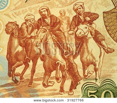 AFGHANISTAN - CIRCA 1979: Horsemen Competing at Buzkashi on 500 Afgani 1979 Banknote from Afghanistan.