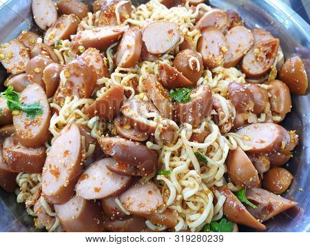 Thai Food Style, Top View Of Instant Noodle Spicy Salad With Sausage As A Background, This Food Is M