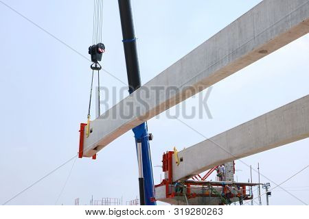 Tower Crane With Guideway Beam On Blue Sky As A Background In The Construction Site, Space For Text 