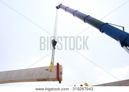Tower Crane With Guideway Beam On Blue Sky As A Background In The Construction Site, Space For Text 