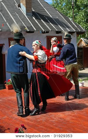 Young dancers in traditional clothe participate at a wedding