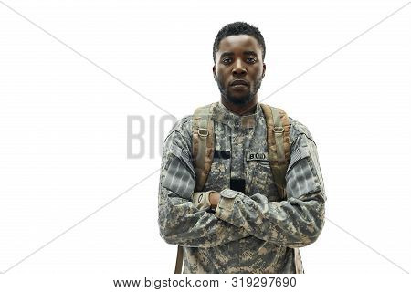 Front View Of American Ranker Confidently Standing With Crossed Hands And Looking At Camera. Young A