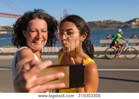 Joyful Excited Female Friends Posing For Selfie Outdoors. Two Women Taking Self Picture On Phone, Sh