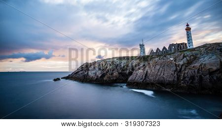 The ruins of the abbey of Saint-Mathieu de Fine-Terre and the lighthouse, Finistere, Brittany, France